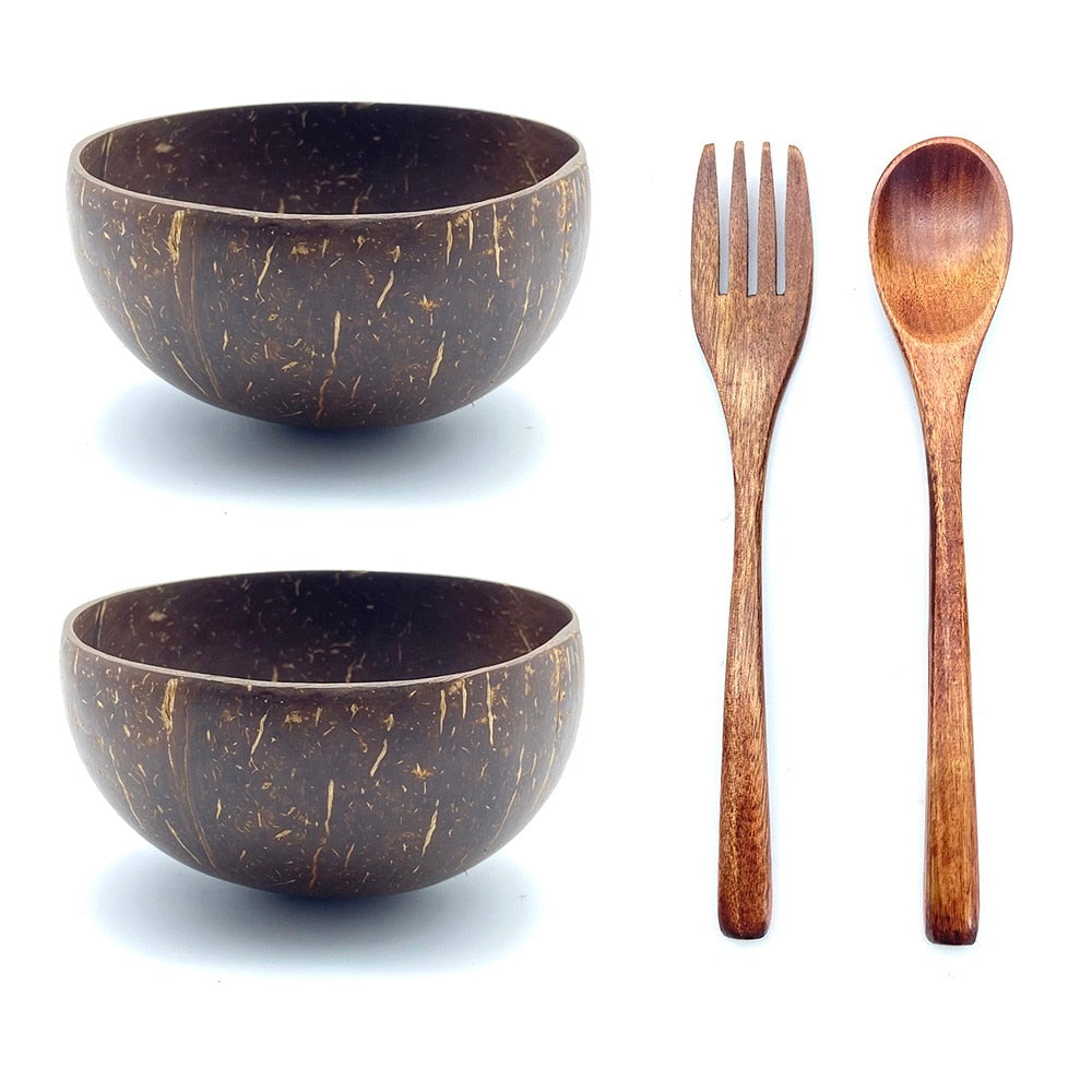 Coconut bowls with wooden fork and spoon