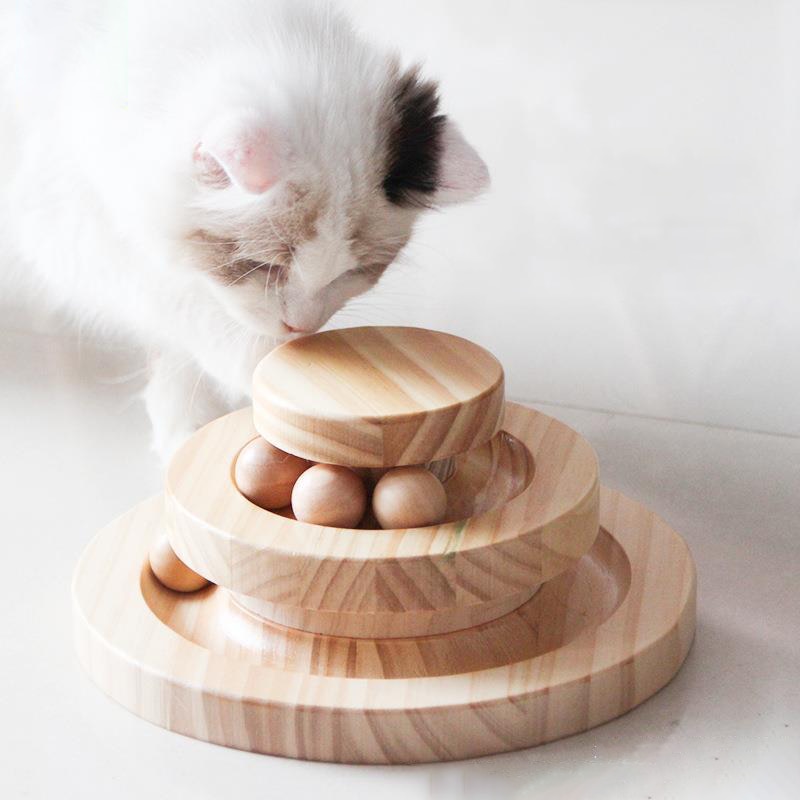cat playing with two tier toy