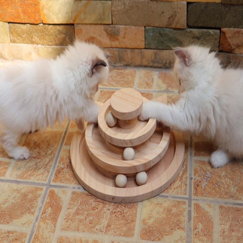 two cats playing with three tier toy