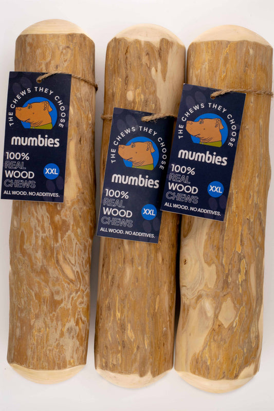 Three wooden dog chew toys with 'mumbies' labels on a white background
