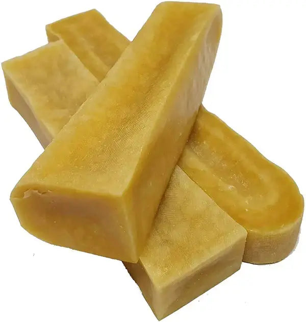 A group of yellow, solid Himalayan Yak Cheese Chews.