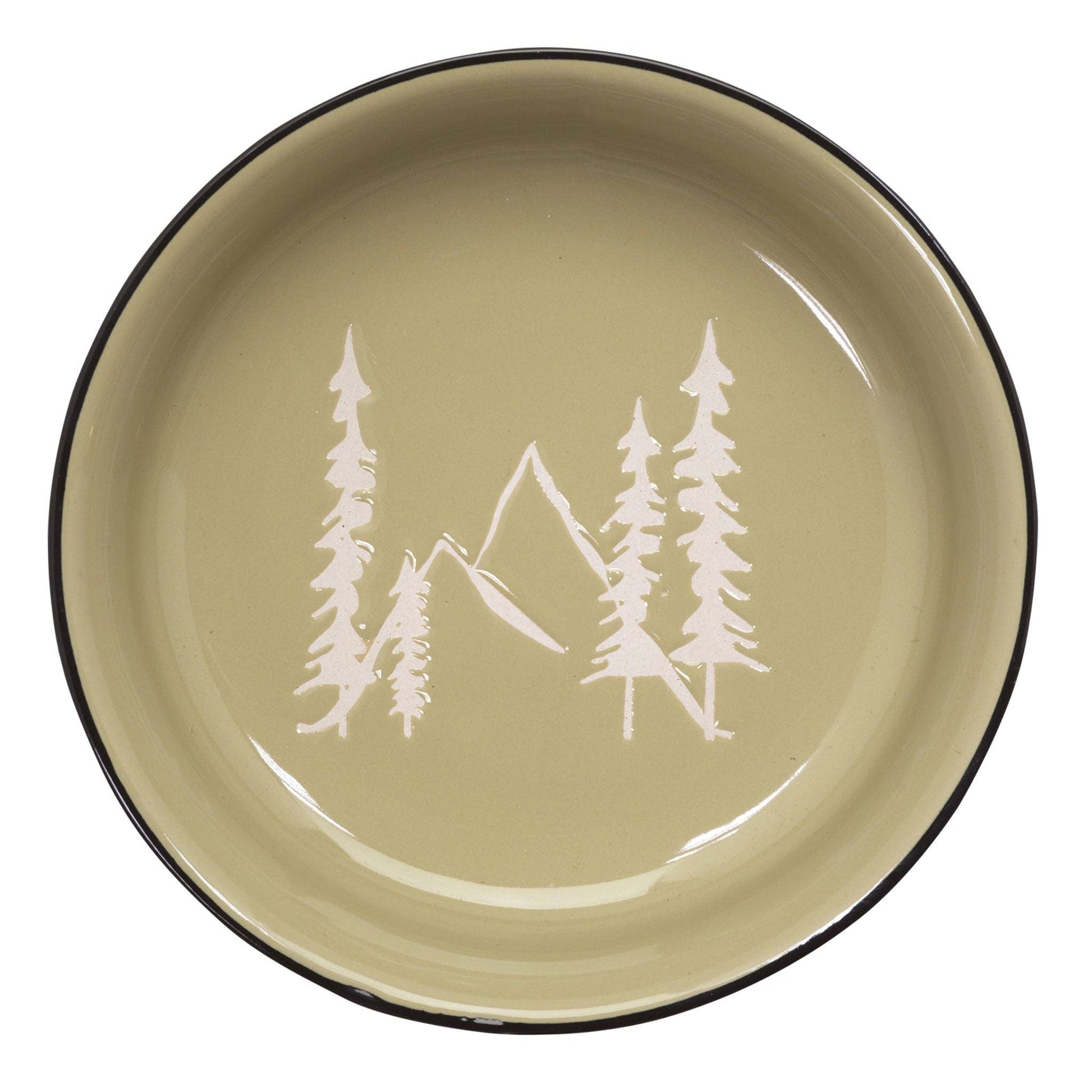 Green plate with white mountain and tree design on a white background
