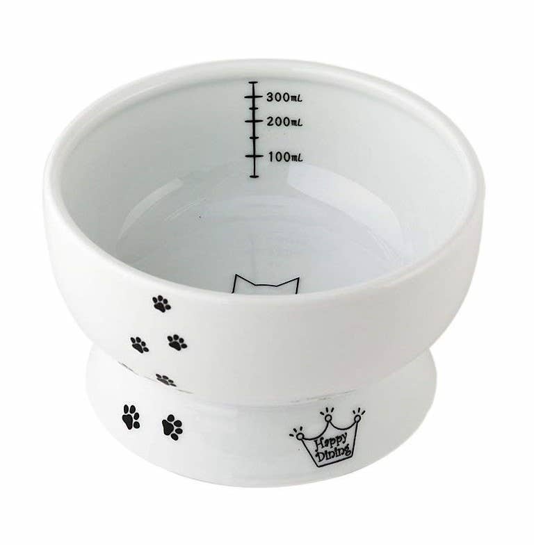 White ceramic bowl with black paw prints and 'Happy Dining' text on a white background